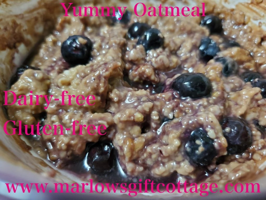 Allergy-friendly, dairy-free, gluten-free oatmeal with cacao, maple, Sunbutter, and blueberries.